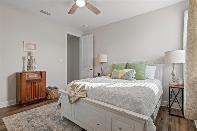 bedroom with dark wood-type flooring and ceiling fan