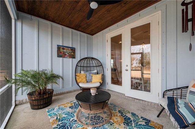 exterior space featuring ceiling fan and wood ceiling