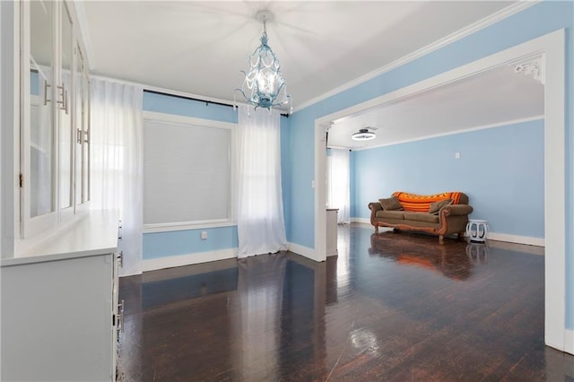 208 Beck St, Atmore, AL 36502 - dining room featuring crown molding, a chandelier, and dark wood finished floors