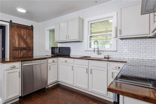 208 Beck St, Atmore, AL 36502 - kitchen with stainless steel dishwasher, black microwave, ornamental molding, a peninsula, and tasteful backsplash
