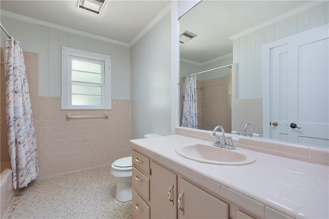 208 Beck St, Atmore, AL 36502 - bathroom featuring crown molding, vanity, tile walls, and shower / bath combo
