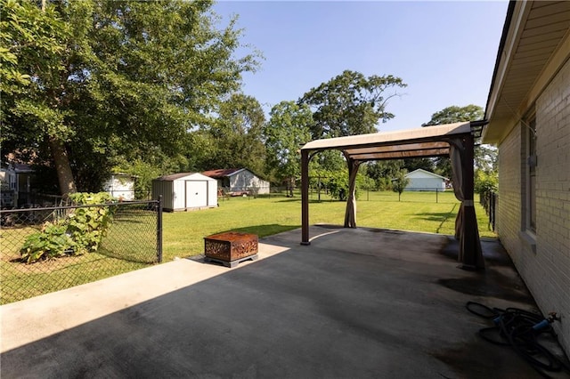 208 Beck St, Atmore, AL 36502 - fenced backyard featuring a shed and a patio area
