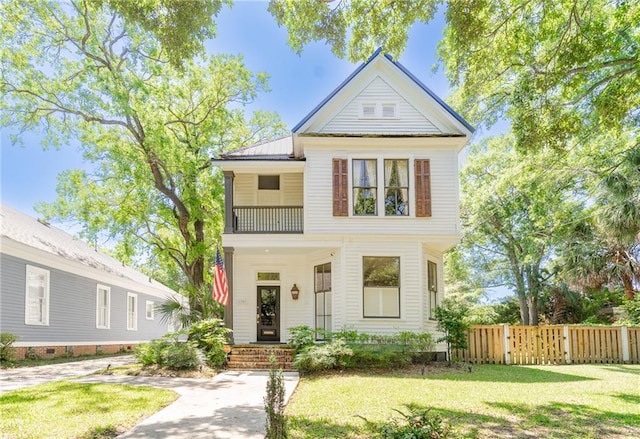 1703 Dauphin St, Mobile, AL 36604 - view of front of property featuring metal roof, a balcony, and a gate