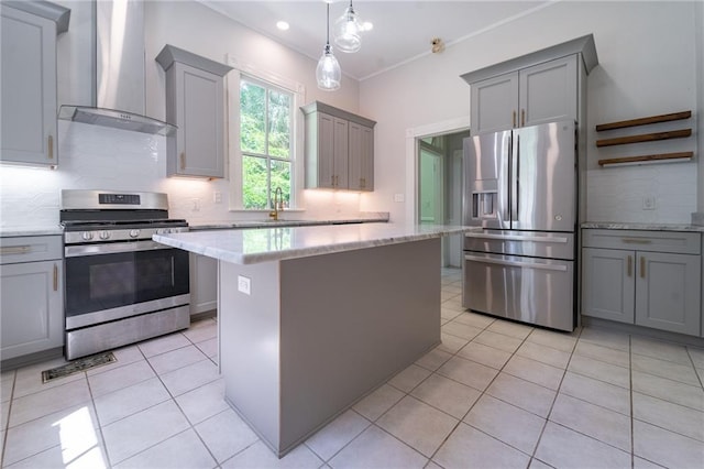 1703 Dauphin St, Mobile, AL 36604 - kitchen featuring stainless steel appliances, wall chimney range hood, gray cabinets, backsplash, and light tile patterned floors