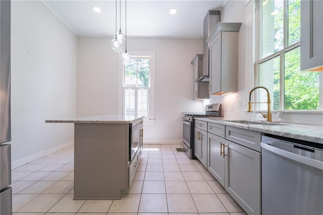 1703 Dauphin St, Mobile, AL 36604 - kitchen featuring appliances with stainless steel finishes, gray cabinetry, a sink, ornamental molding, and light stone countertops
