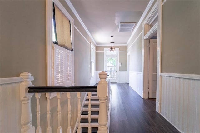 1703 Dauphin St, Mobile, AL 36604 - corridor with wainscoting, dark wood finished floors, a decorative wall, crown molding, and a chandelier