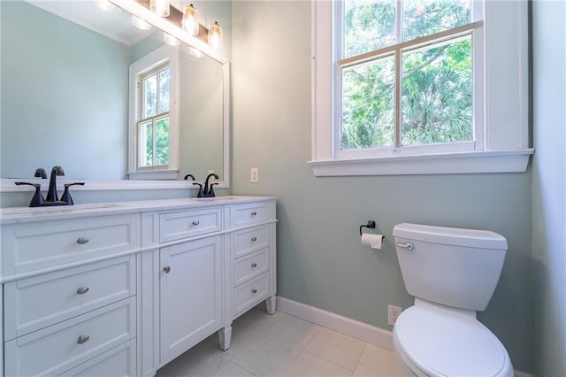 1703 Dauphin St, Mobile, AL 36604 - bathroom with vanity, toilet, baseboards, and tile patterned floors