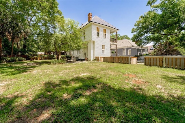 1703 Dauphin St, Mobile, AL 36604 - back of house with a chimney and metal roof