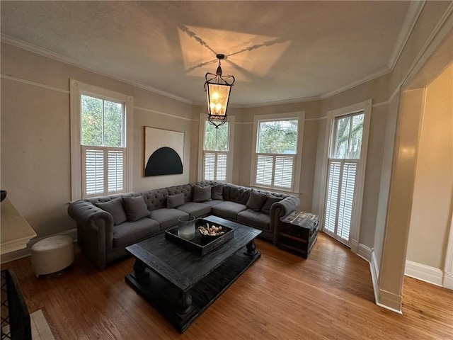 1703 Dauphin St, Mobile, AL 36604 - living area with healthy amount of natural light, wood finished floors, baseboards, and ornamental molding