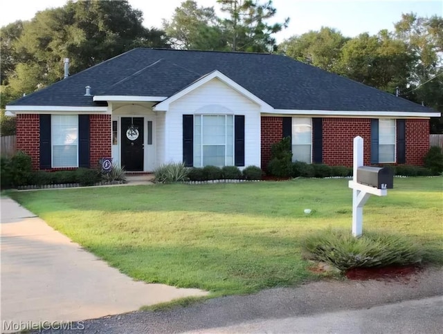 ranch-style home with a front lawn