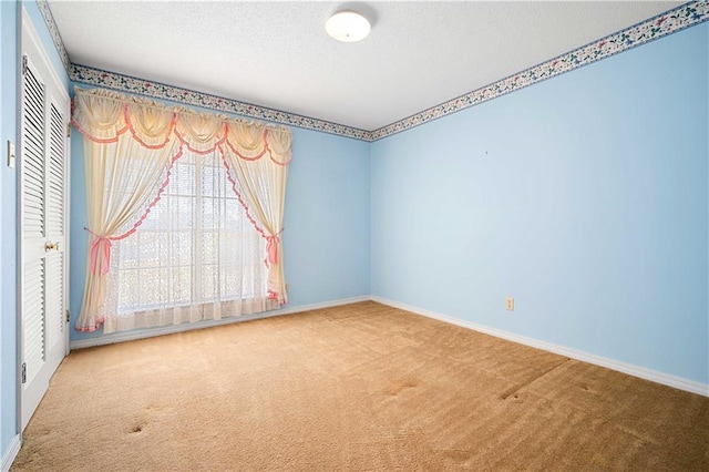 empty room with carpet flooring