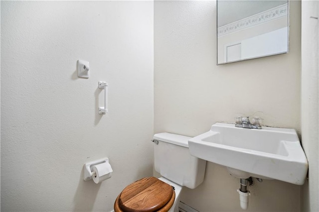 bathroom featuring toilet