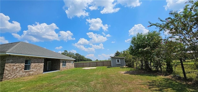 view of yard featuring a storage unit