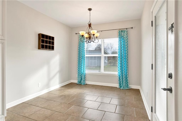 unfurnished dining area featuring a healthy amount of sunlight, tile patterned flooring, and a chandelier