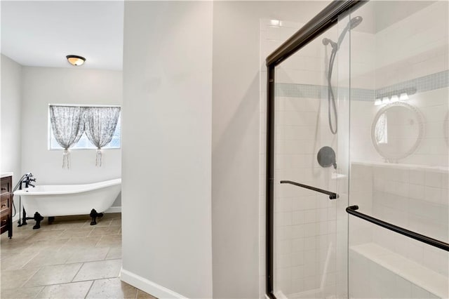 bathroom featuring separate shower and tub