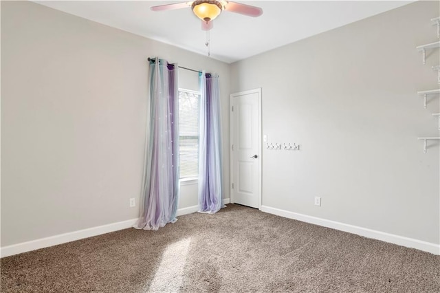 spare room with ceiling fan and carpet floors