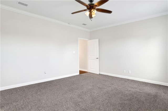 carpeted spare room with ceiling fan and ornamental molding