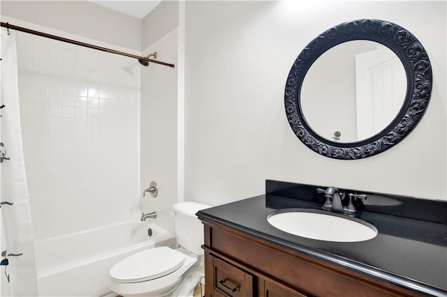 full bathroom with shower / bath combo with shower curtain, toilet, and vanity