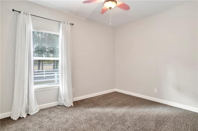 carpeted empty room featuring ceiling fan