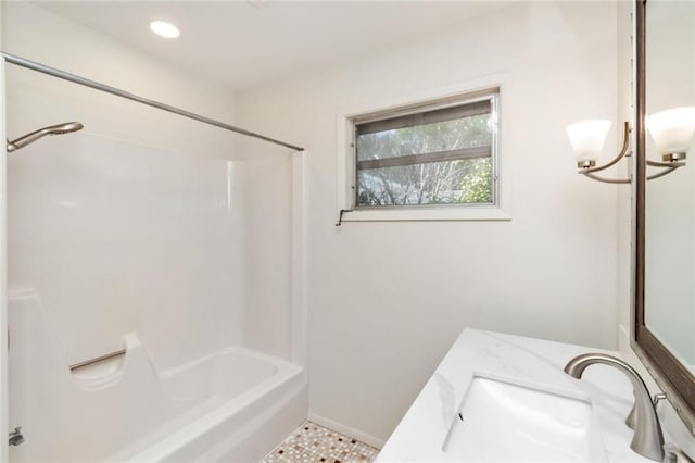 bathroom featuring shower / tub combination, tile patterned floors, and sink