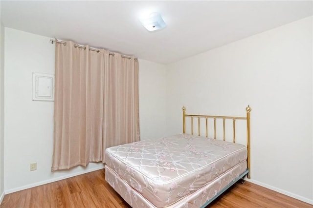 bedroom with wood-type flooring