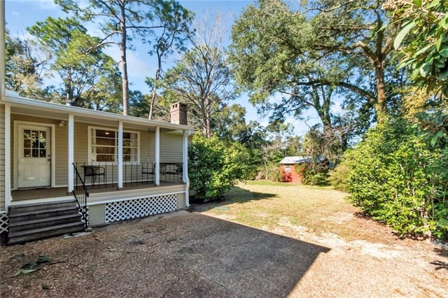 view of yard featuring a porch