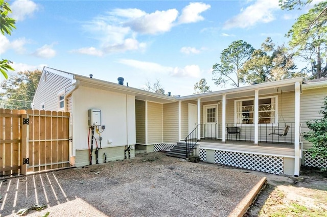 back of house with covered porch