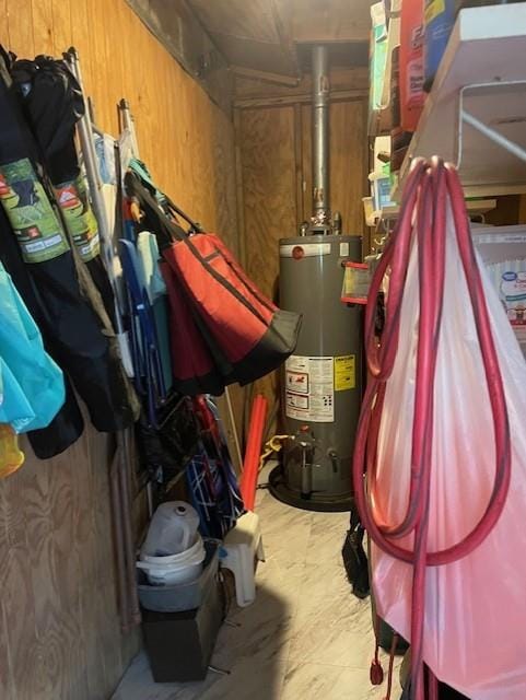 utility room featuring gas water heater