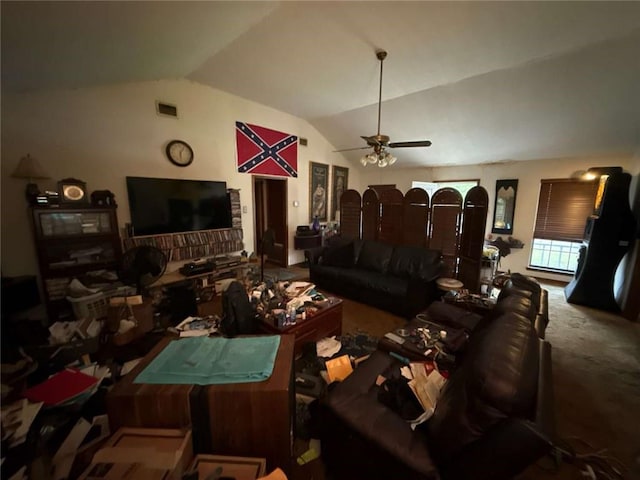 living area featuring lofted ceiling, a ceiling fan, and carpet