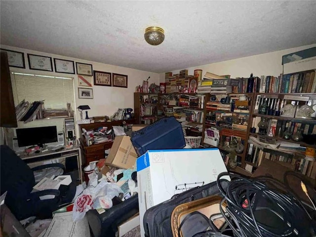 miscellaneous room with a textured ceiling