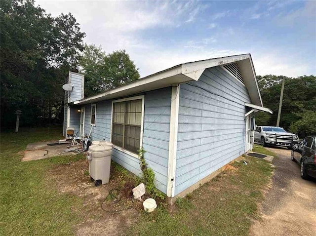 view of side of property featuring a chimney