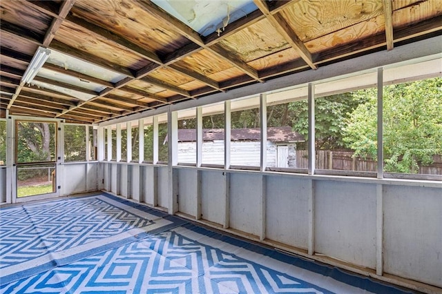 unfurnished sunroom with a wealth of natural light