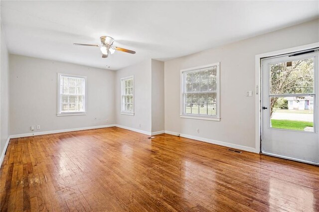 kitchen with ceiling fan, light hardwood / wood-style floors, white cabinetry, and white refrigerator