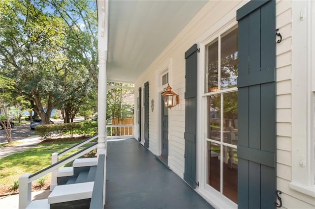 view of side of home featuring a porch