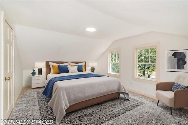 bedroom featuring vaulted ceiling