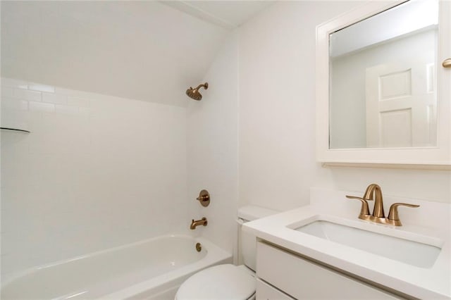 full bathroom with tiled shower / bath combo, toilet, and vanity