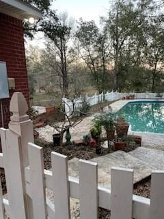 view of pool with a fenced in pool