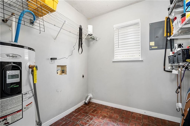 laundry area featuring baseboards, laundry area, electric dryer hookup, washer hookup, and electric water heater