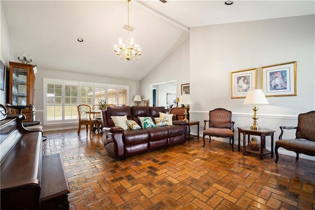 living room with beam ceiling, high vaulted ceiling, an inviting chandelier, brick floor, and baseboards