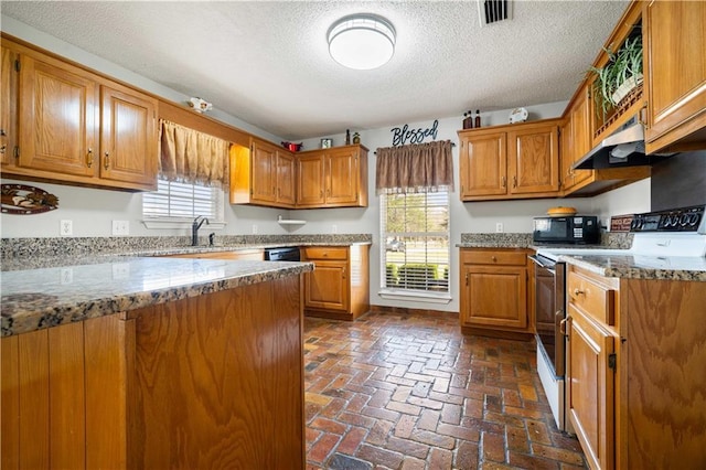 kitchen with white electric range, visible vents, brown cabinets, and black microwave