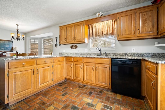 kitchen featuring a sink, brown cabinets, dishwasher, and a peninsula