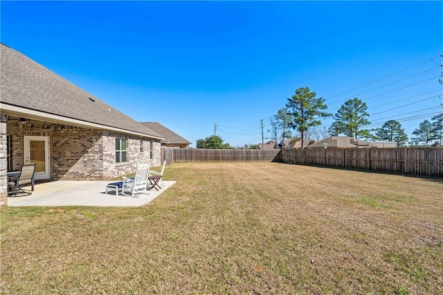 view of yard with a fenced backyard and a patio