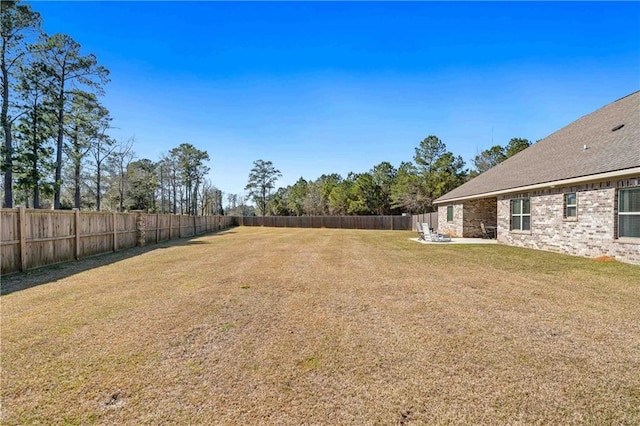 view of yard with a fenced backyard