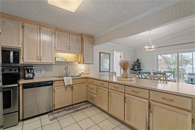 kitchen with appliances with stainless steel finishes, a sink, light brown cabinets, a textured ceiling, and ornamental molding
