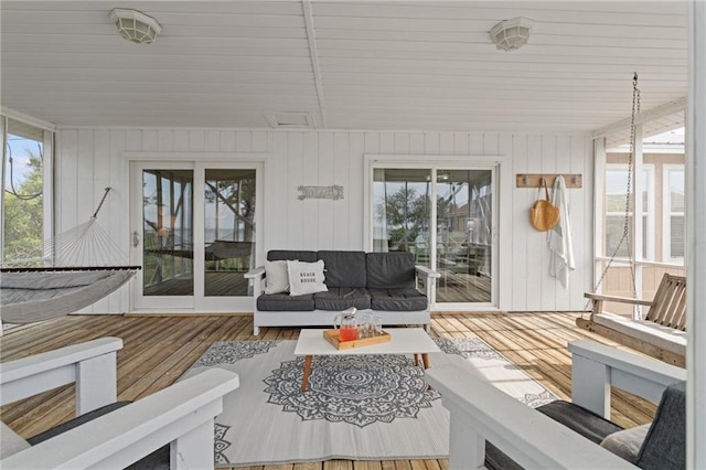 sunroom with an outdoor hangout area and healthy amount of natural light