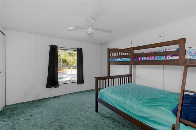 carpeted bedroom with visible vents and a ceiling fan