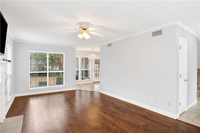 unfurnished living room featuring ornamental molding, ceiling fan with notable chandelier, and light hardwood / wood-style floors