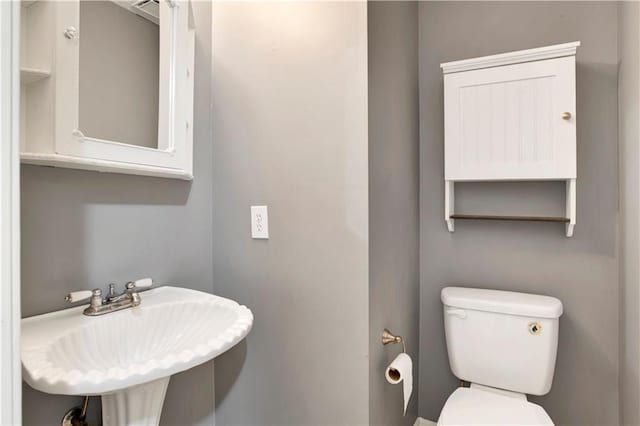 bathroom with sink and toilet