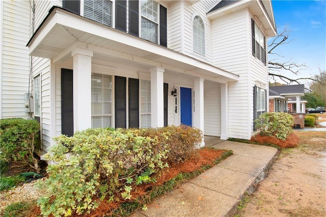 property entrance featuring covered porch