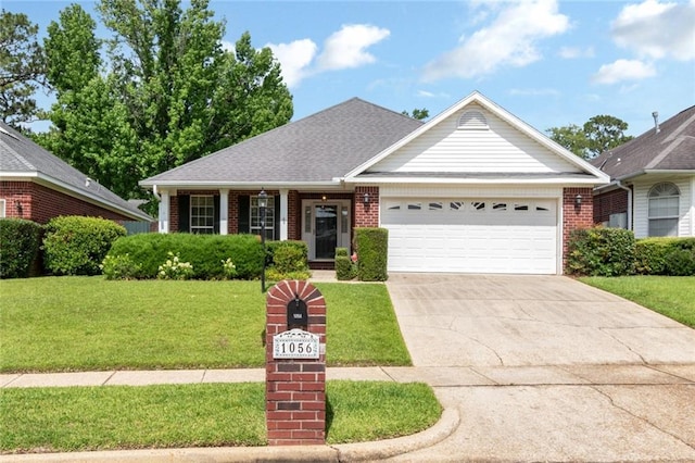 1056 Cross Gates Pl, Mobile, AL 36609 - view of front facade featuring a garage, brick siding, a front lawn, and driveway
